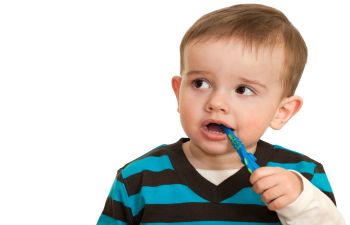 Small Child Brushing Teeth